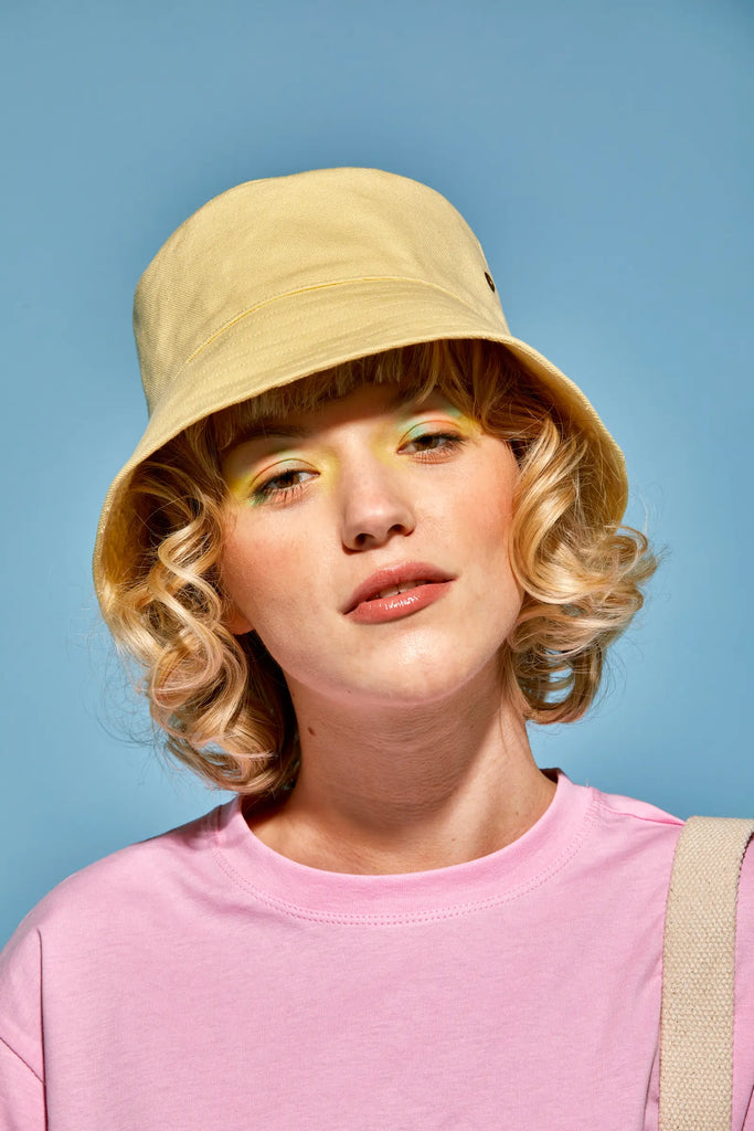 Girl wearing bucket hat sales